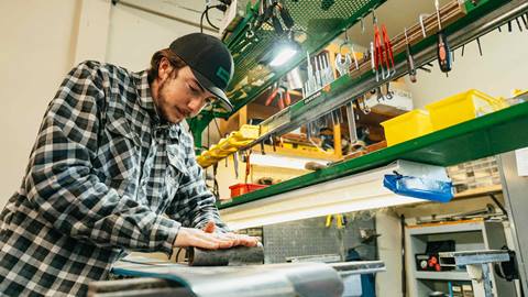 Rental shop tech at June Mountain tuning skis.