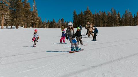 group of kids snowboarding with Bucky
