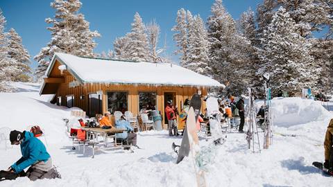 Stew Pot Slims covered in snow with people outside