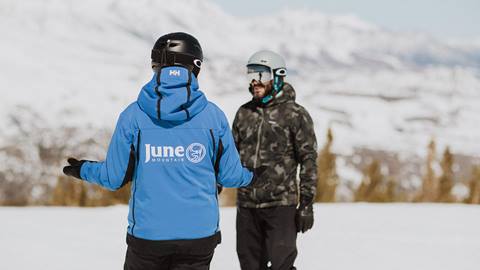 Instructor teaching a private snowboard lesson at June Mountain