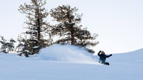 snowboarder hitting a powder stash